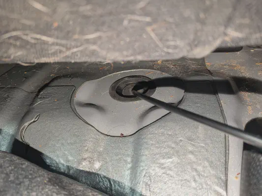 spare grommet under back seats